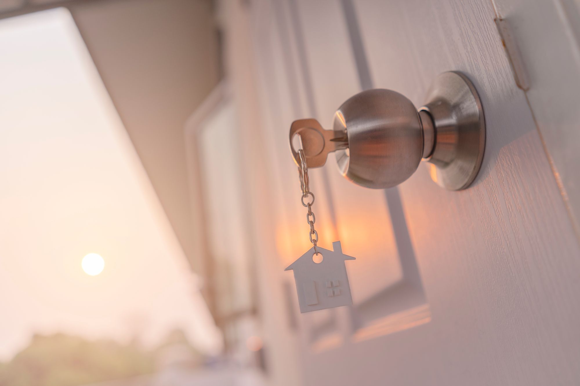 Key in door with house keychain